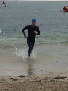 Paul Jarrett exiting the water after his swim leg